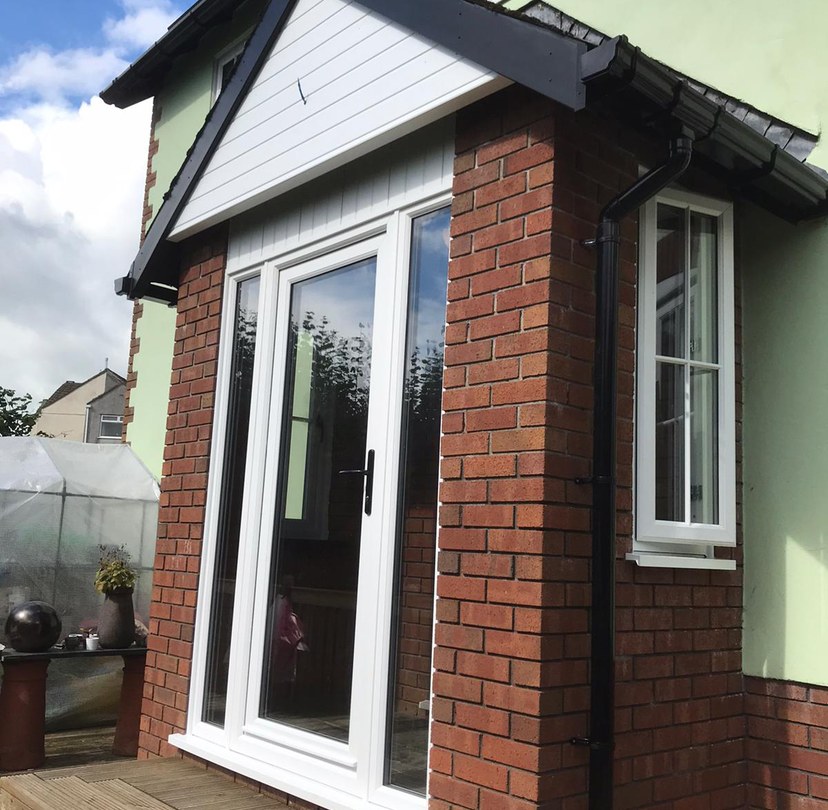 White glazed garden doors on a brick extension