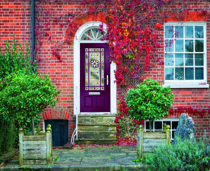 Entrance door with a decorative stained-glass panel