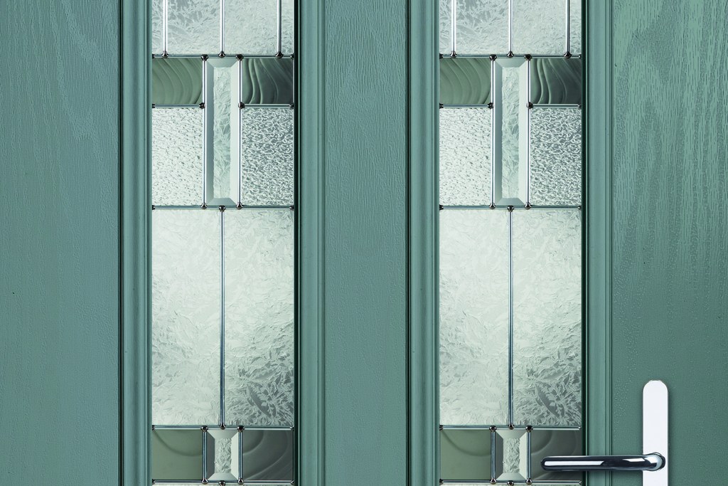Textured and bevelled glass panels in an entrance door
