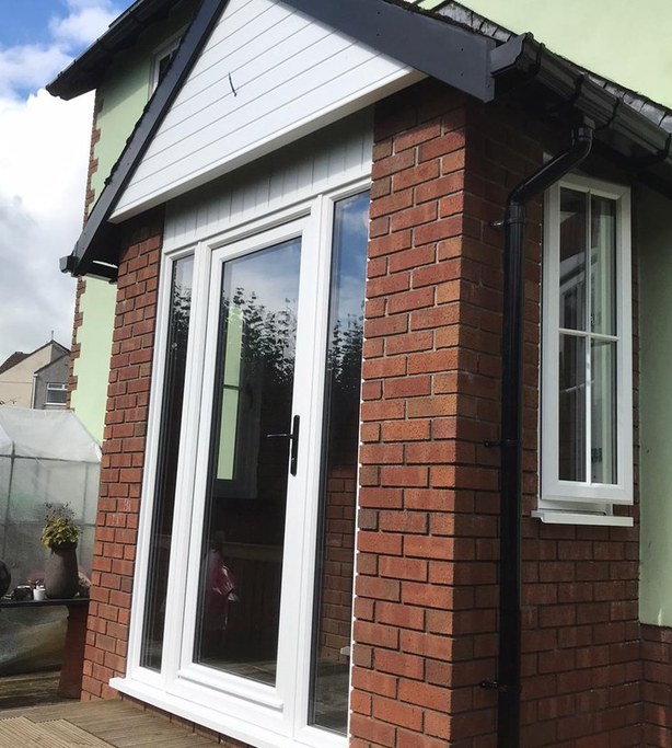White glazed garden doors on a brick extension