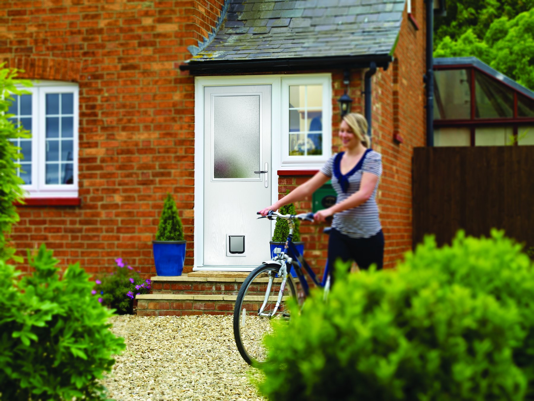 Homeowner arriving at a modern glazed back door
